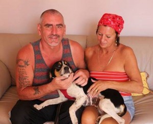 Andie in the loving arms of adopters John and Chris Ellett Photo: John Ellett